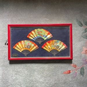 Oriental fans in frame